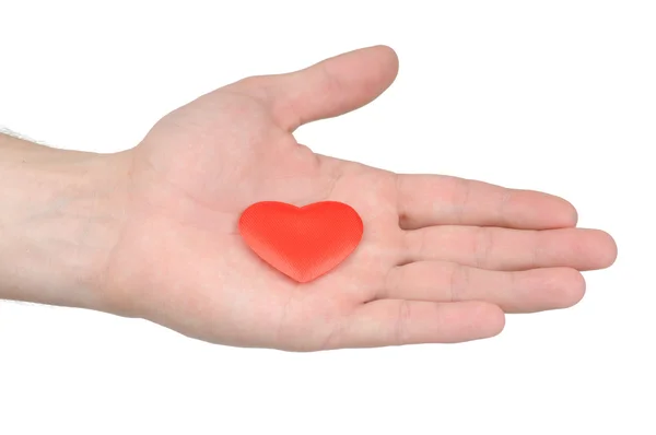 Corazón de San Valentín en una mano femenina aislada sobre fondo blanco — Foto de Stock