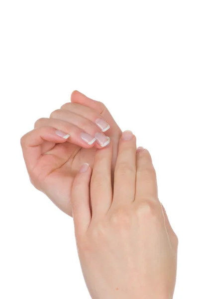 Mãos de mulher com manicure francês isolado no fundo branco — Fotografia de Stock