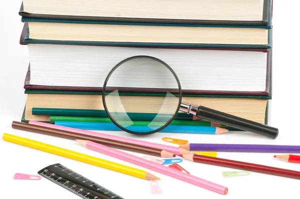 Book heap and color pencils isolated on white background — Stock Photo, Image