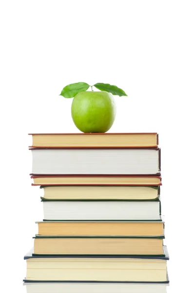 Book heap and apple — Stock Photo, Image