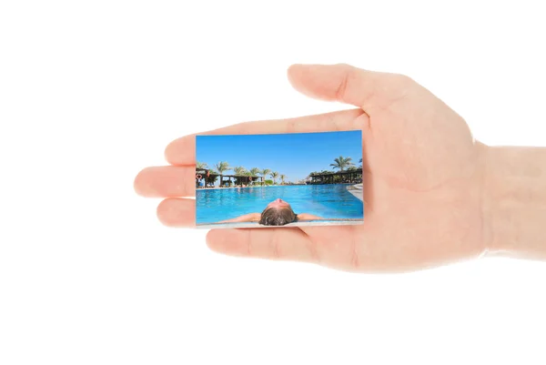 Hand and a travel card isolated on white — Stock Photo, Image