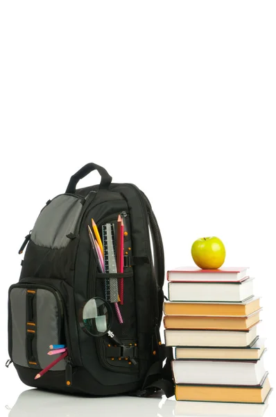 Backpack and book heap — Stock Photo, Image