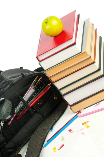 Backpack and book heap — Stock Photo, Image