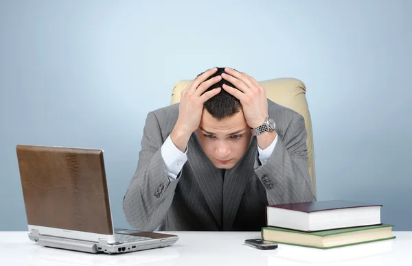 Tired businessman on blue background — Stock Photo, Image