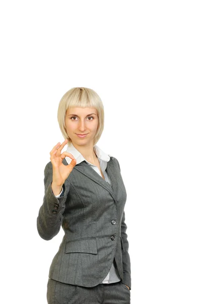 Businesswoman smiling doing the ok sign isolated on white background — Stock Photo, Image