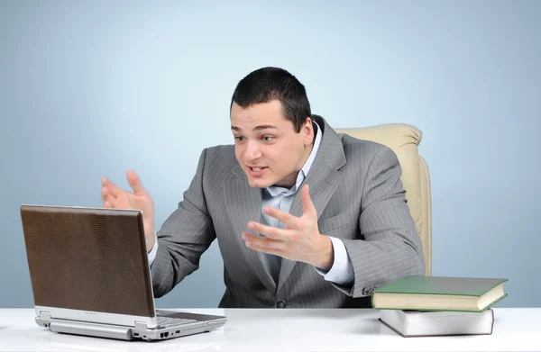 Businessman playing video game at working hours — Stock Photo, Image