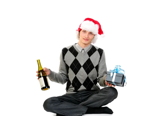 Een jonge man na kerstnacht geïsoleerd op witte achtergrond — Stockfoto