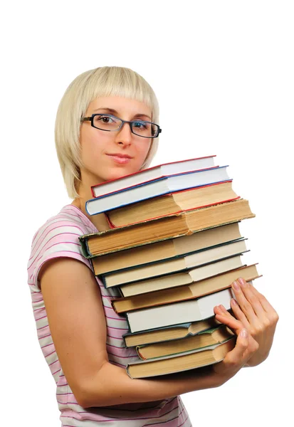 Mladá žena s kniha haldy — Stock fotografie