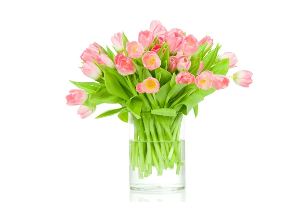 Różowe tulipany w wazonie na białym tle — Zdjęcie stockowe