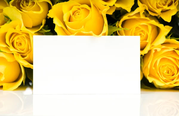 Yellow roses with greeting card — Stock Photo, Image