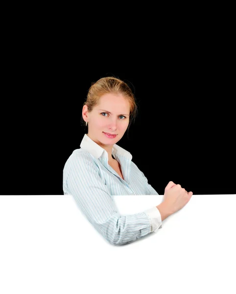 Woman holding the blank billboard isolated on black background — Stock Photo, Image