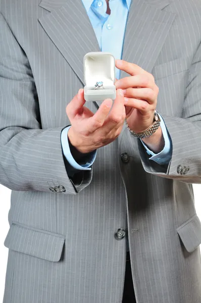 Man holding a gift box with jewelry — Stock Photo, Image