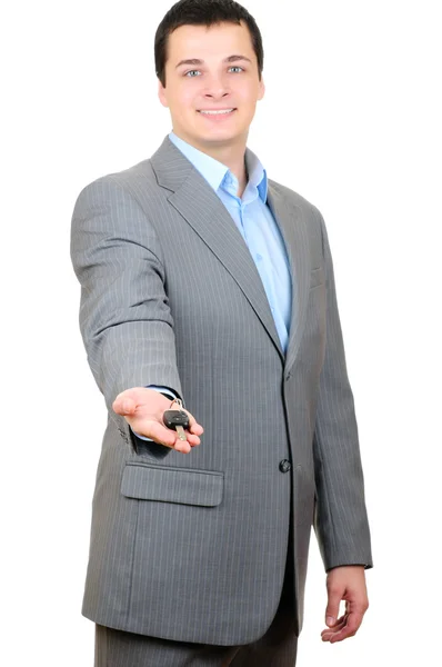 Businessman holding key isolated on white background — Stock Photo, Image