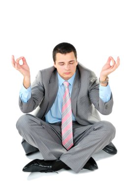 Beyaz arka plan üzerinde izole lotus pozisyonda oturan işadamı