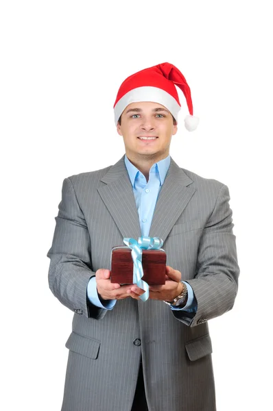 Empresário no chapéu do Papai Noel segurando caixa de presente isolado no fundo branco — Fotografia de Stock