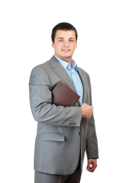 Young man holding book isolated on white background — Stock Photo, Image