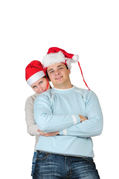 Casal feliz em chapéus do Papai Noel isolado no fundo branco — Fotografia de Stock