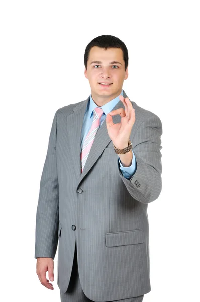 Gelukkig lachend vrolijke jonge zakenman met oke gebaar — Stockfoto