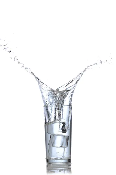 Water splashes in the glass isolated on white — Stock Photo, Image