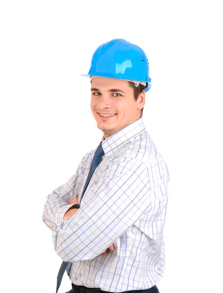 Hombre de negocios feliz con sombrero duro azul de pie con confianza aislado sobre fondo blanco —  Fotos de Stock
