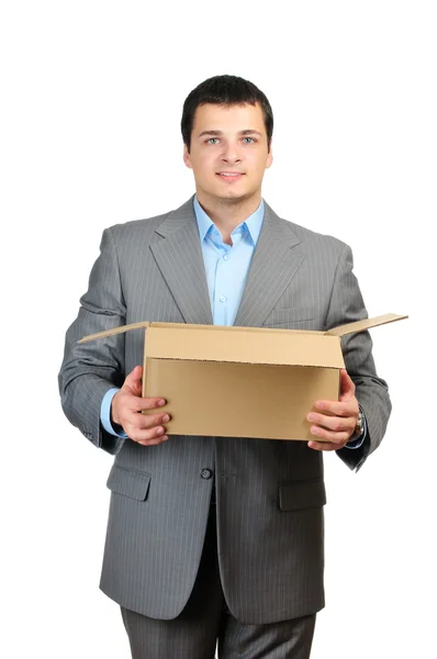 You are fired! Young businessman hold cardboardbox with personal belongings isolated on white background — Stock Photo, Image