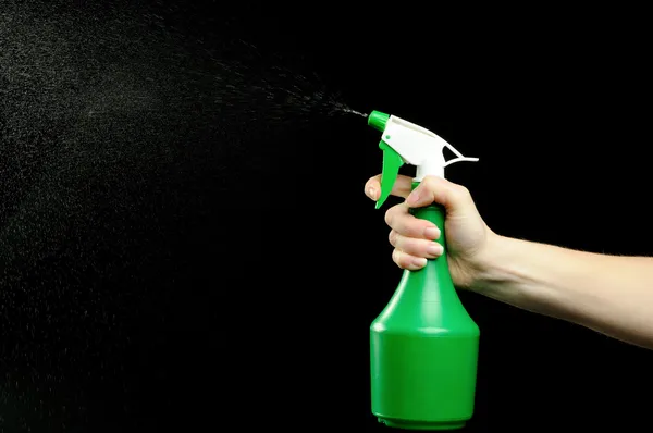 Hand and spray bottle for cleaning up — Stock Photo, Image