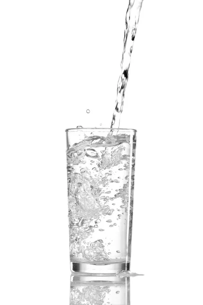 Water splashes in the glass on white background — Stock Photo, Image