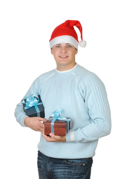 Young man in santa's hat holding present box isolated on white background — Stock Photo, Image