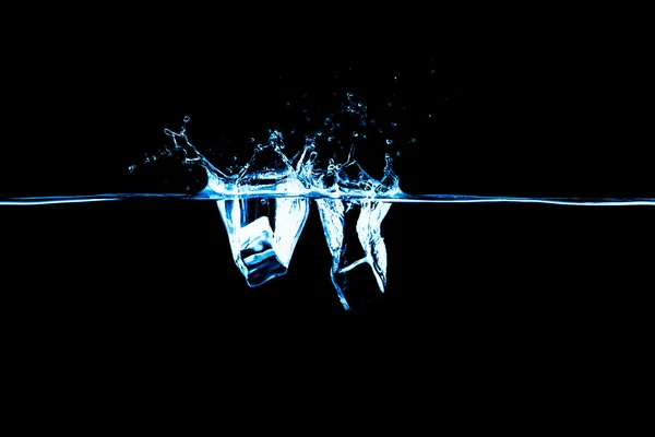 Ice cube in water on black background — Stock Photo, Image