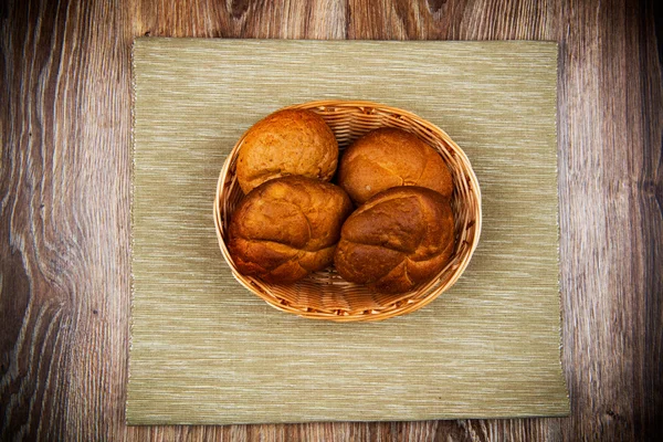 Fresh bread on the wooden table — Stock Photo, Image