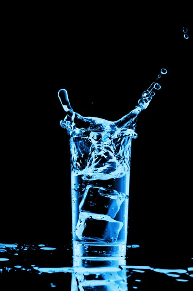 Glass of water with ice cubes on black background — Stock Photo, Image