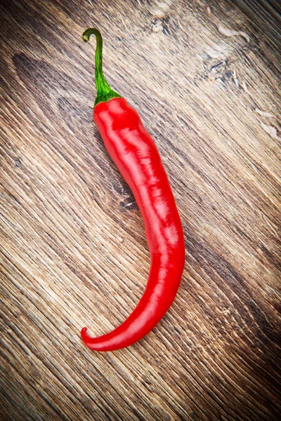 Red hot chili pepper on wooden background — Stock Photo, Image