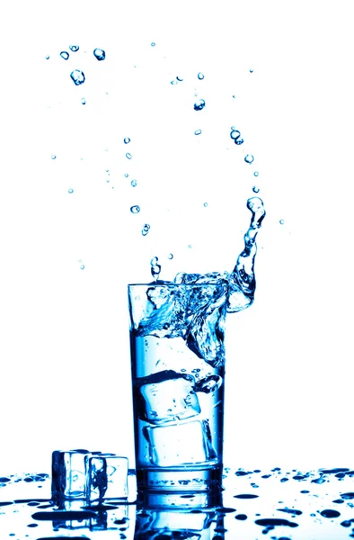 Water splashes in the glass on white background — Stock Photo, Image