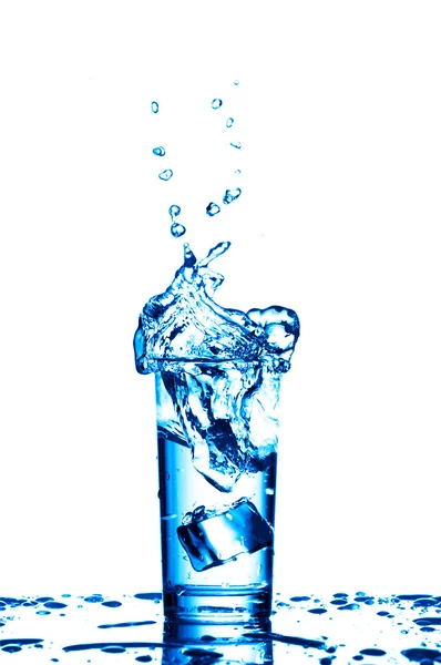 Water splashes in the glass on white background — Stock Photo, Image