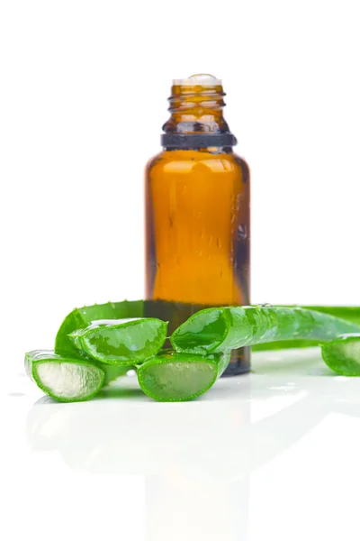 Sliced aloe leaves with bottle extract — Stock Photo, Image