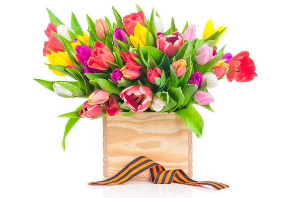 Tulips in the wooden box with ribbon — Stock Photo, Image