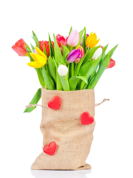 Tulpen im Sack auf weißem Hintergrund — Stockfoto
