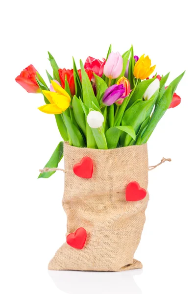 Tulpen im Sack auf weißem Hintergrund — Stockfoto