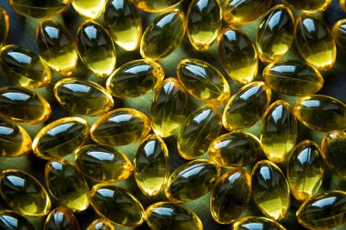 Omega 3 kapsüllerinin arka plan dokusu, balık yağı, sağlık, koyu