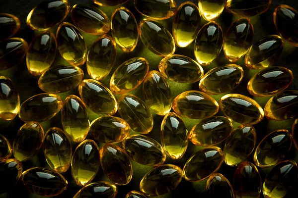 Omega 3 kapsüllerinin arka plan dokusu, balık yağı, sağlık, koyu
