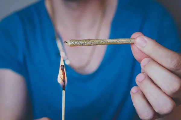 Close Adult Man Lights Matches Smoking Medical Marijuana Joint Concept — Stok Foto