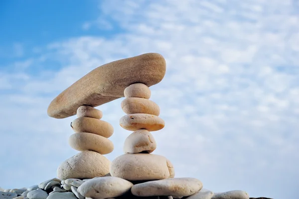 Pebbles and cloudy sky — Stock Photo, Image