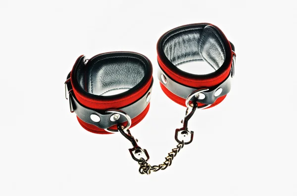 Red leather handcuffs — Stock Photo, Image