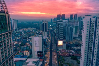 Dramatic sunset of Manila city in capital Philippines. clipart