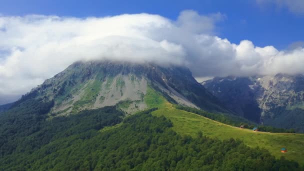Aerial view over mountains under cloudy sky in summer day in Komovi Mountains, Montenegro. — Stock Video