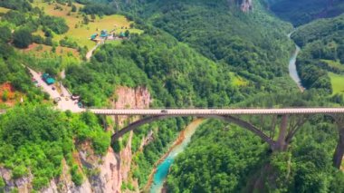Around on the Djurdjevic Bridge in Montenegro is a concrete arch bridge across the Tara River. Aerial drone view.