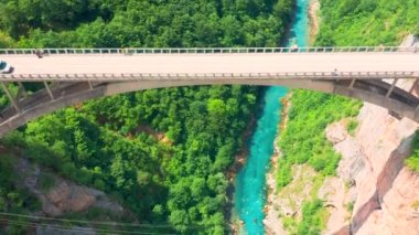 Aerial top view on the Djurdjevic Bridge in Montenegro is a concrete arch bridge across the Tara River.