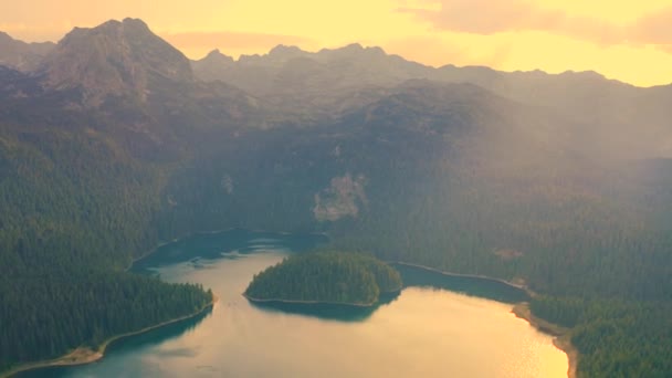 Aerial view on Black Lake on sunset time with in the Durmitor National Park in Zabljak, Montenegro. — Video