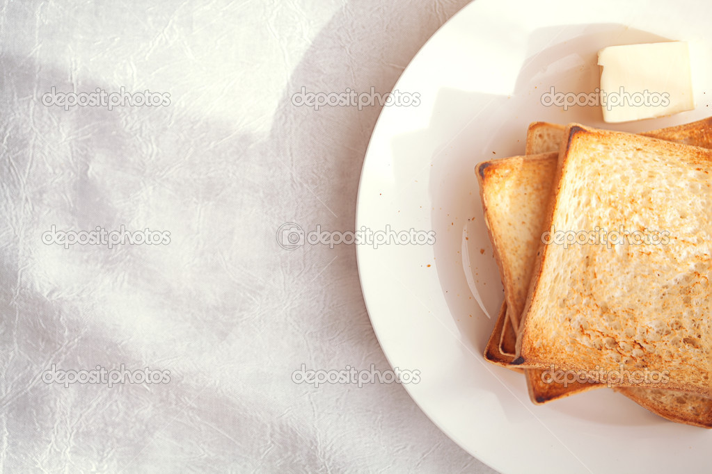 Toasted bread slices with butter pat for breakfast