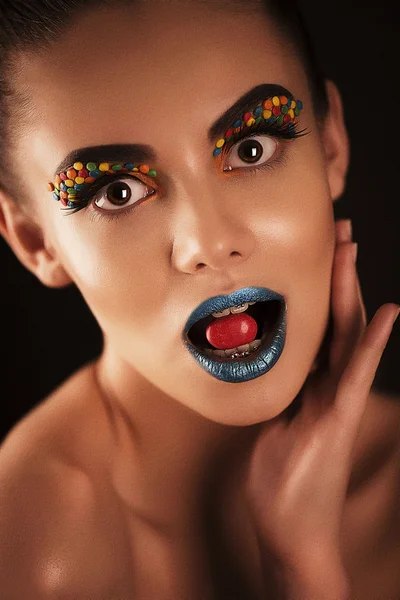 The girl with candies — Stock Photo, Image